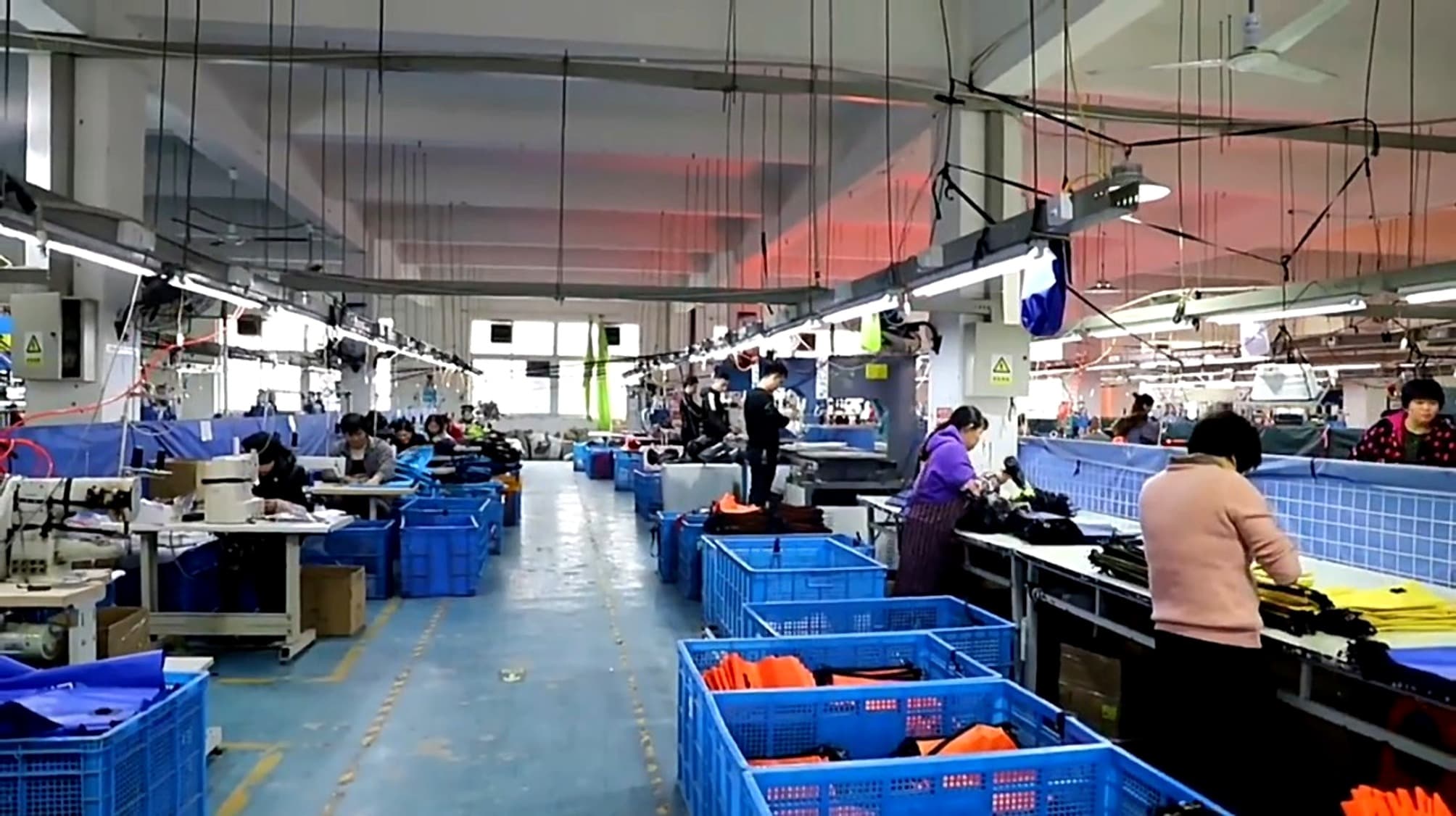 Workshop floor with workers and production lines